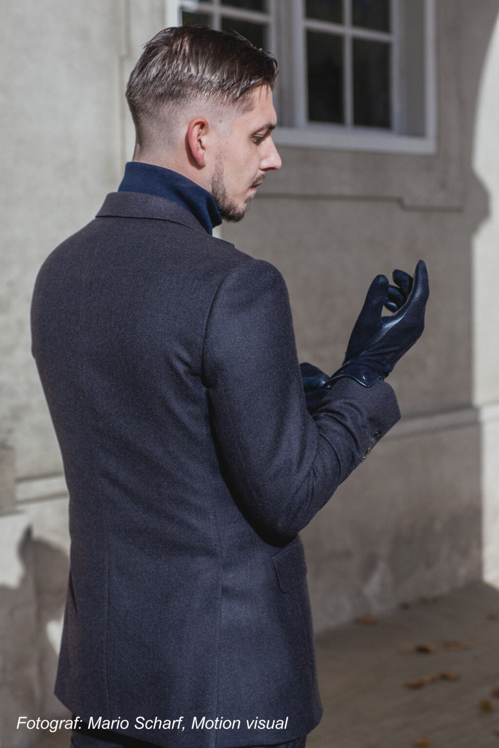 Man in jacket and gloves